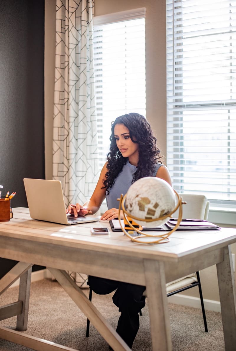Desk setup with laptop used for mobile notary coordination in Houston.